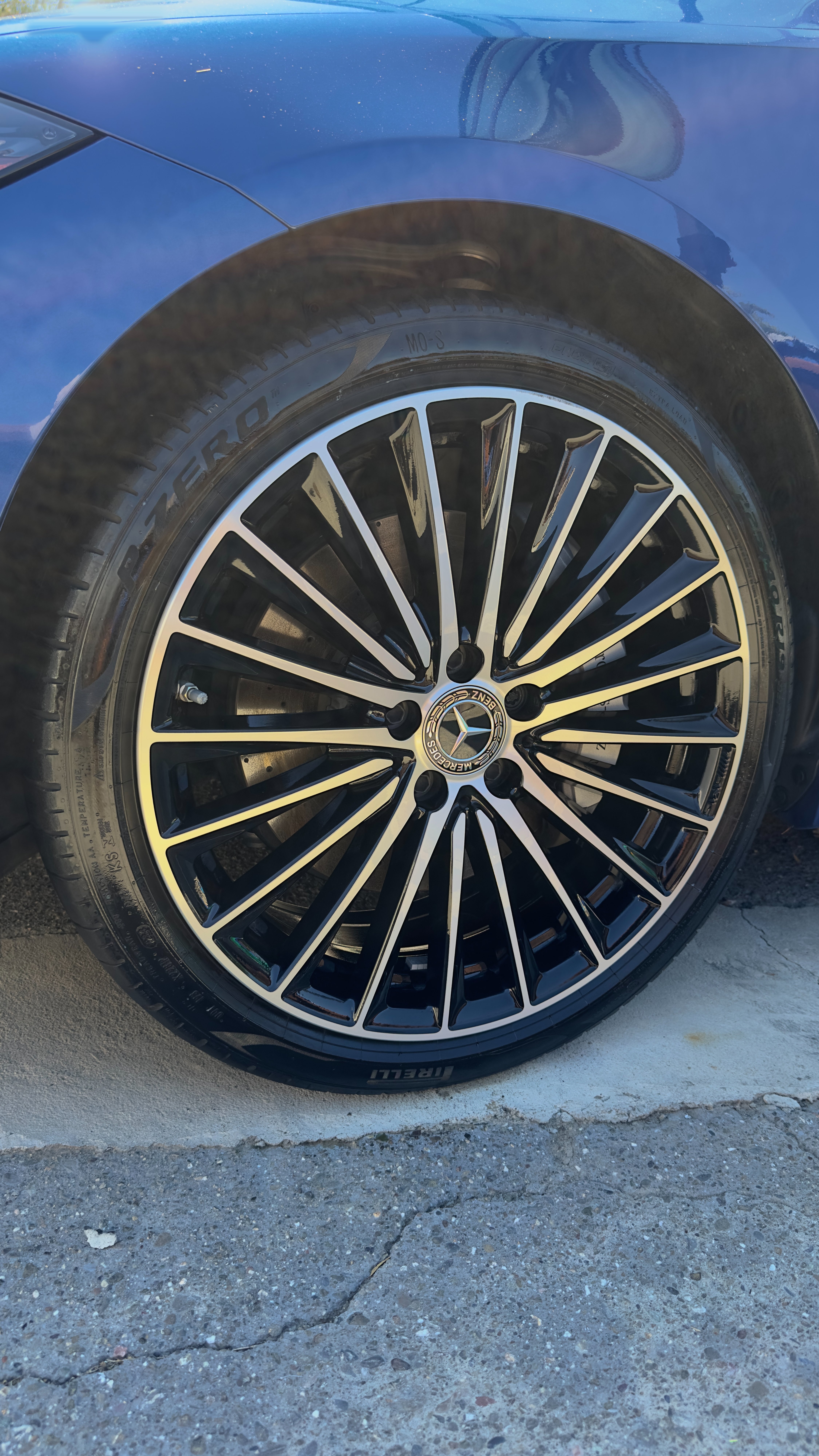 The same Mercedes wheel in flawless gloss black — after detailing by Happy Valley Detailing